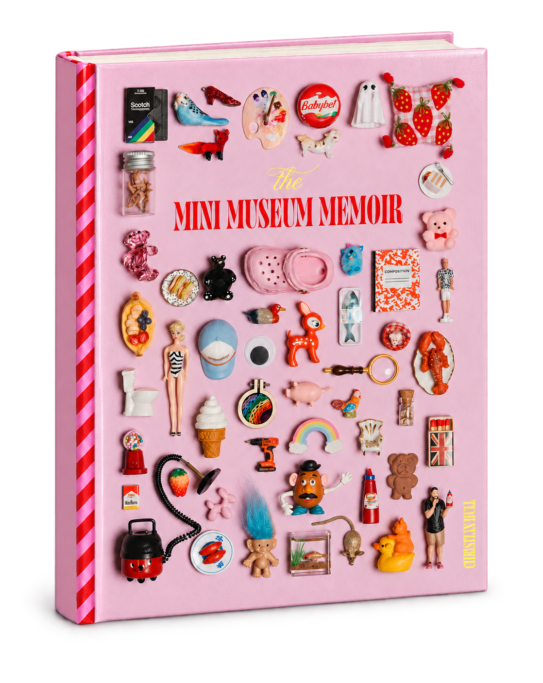 Close-up of the Mini Museum Memoir hardcover showing the cover title and miniature objects